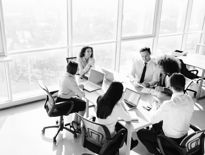 Teamwork in boardroom. Team members having business meeting.