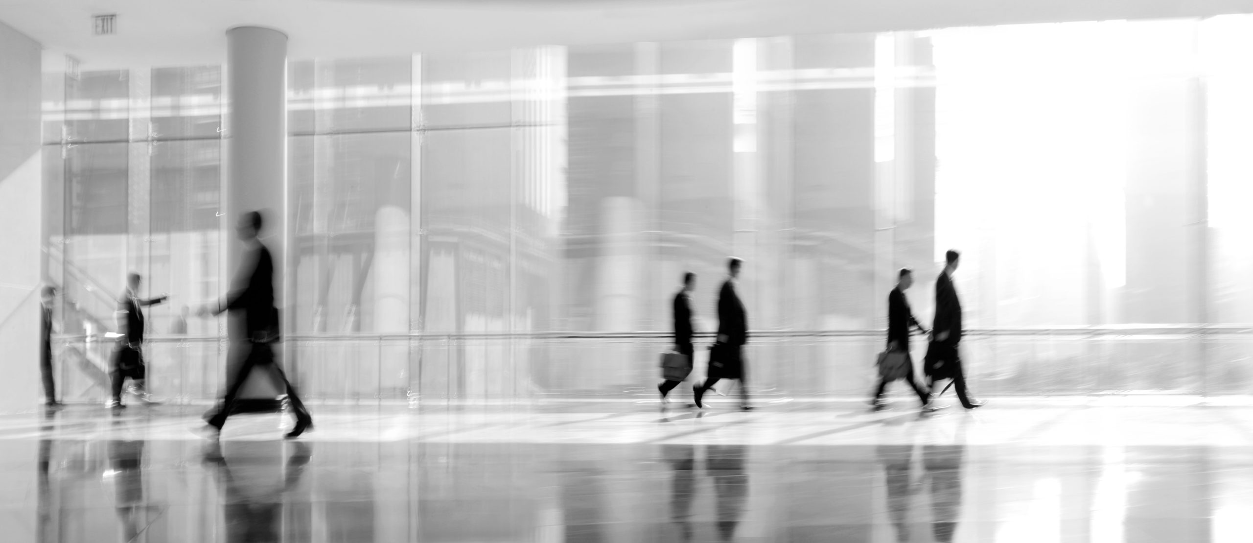 abstrakt image of people in the lobby of a modern business center with a blurred background